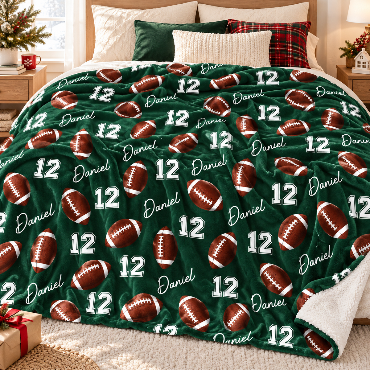A green football pattern blanket with name Daniel and number 12 spread across a made bed.