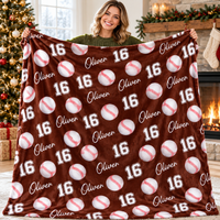 A woman displays a brown baseball pattern blanket personalized with the name Oliver and number 16.