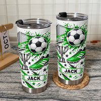 Two green soccer tumbler personalized custom name cups with black lids displayed against a white tiled wall.