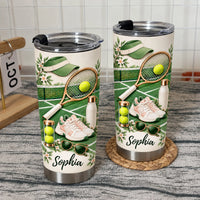 Two custom insulated tumblers with splash-proof lids on a textured mat in front of a white tiled wall.