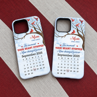 Two Memorial Cardinal Phone Cases featuring watercolor red birds and a September 2025 calendar on a red and white striped