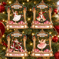 Four personalized Nutcracker acrylic ornaments hanging on a Christmas tree, featuring Clara, Soldier, Mouse King, and Sugar