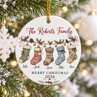 Merry Christmas 2026 personalized family ornament hanging on a snowy Christmas tree with warm lights.