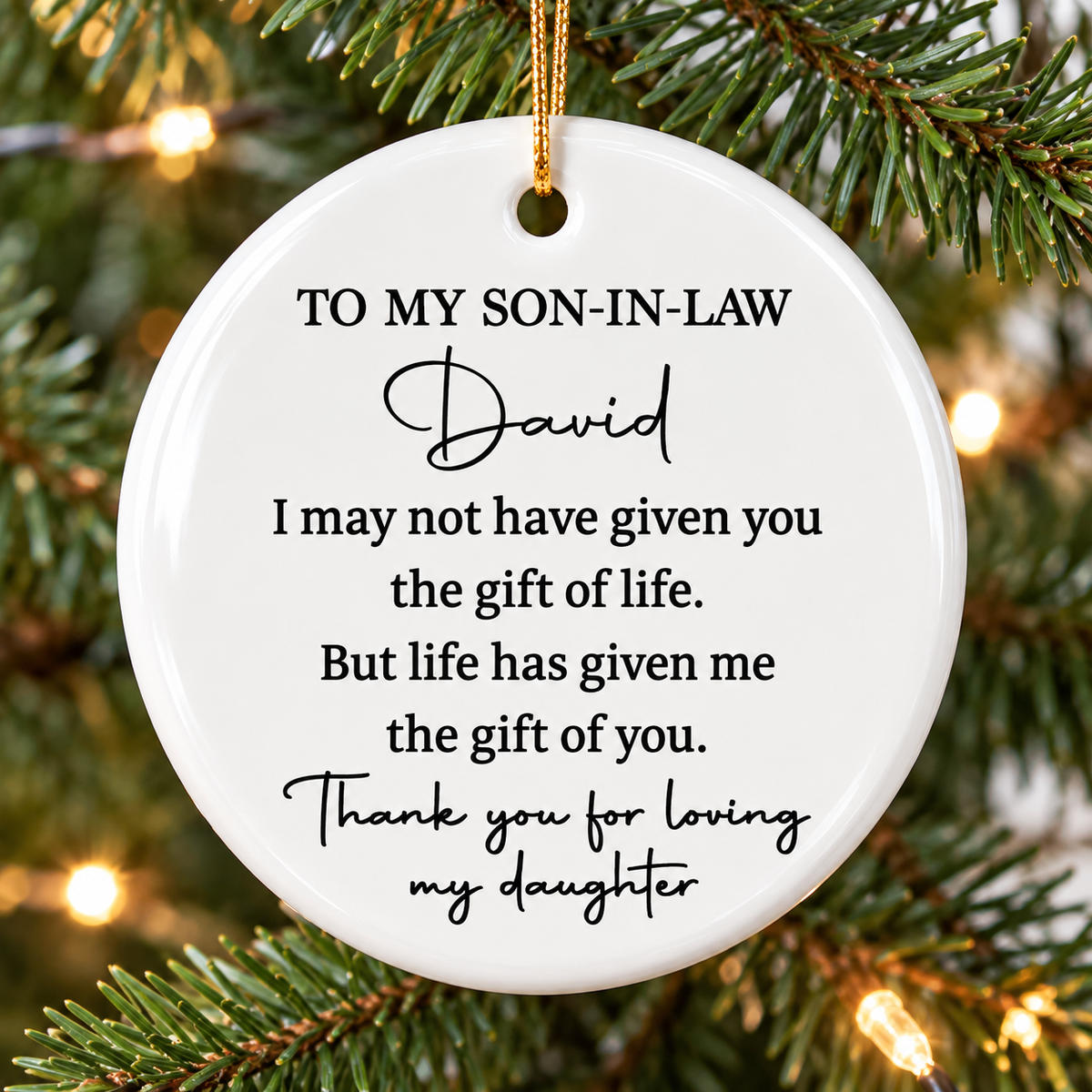 To My Son-In-Law ornament hanging on a glowing Christmas tree with warm lights and green pine needles.