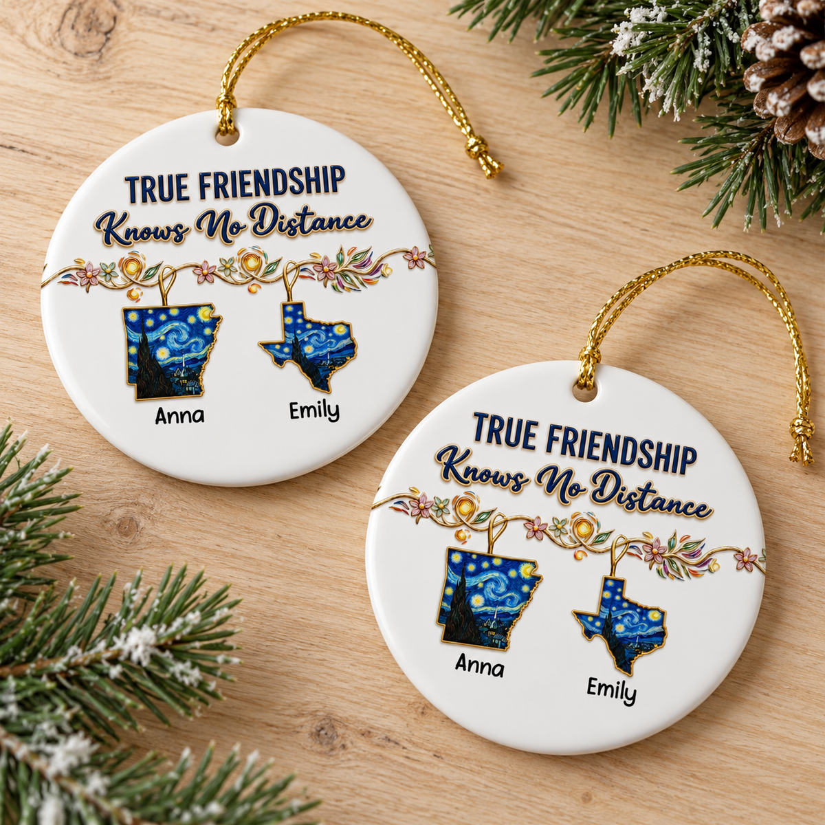 Two long distance best friend gift ornaments resting on a rustic wooden surface next to pine tree branches.