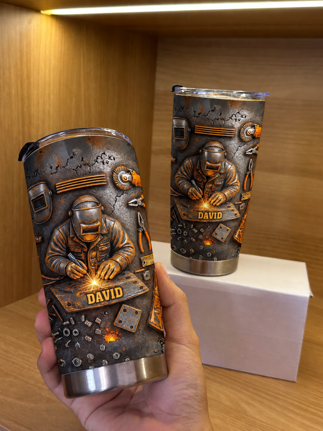Hand holding a custom name welder personalized tumbler with industrial rust design.