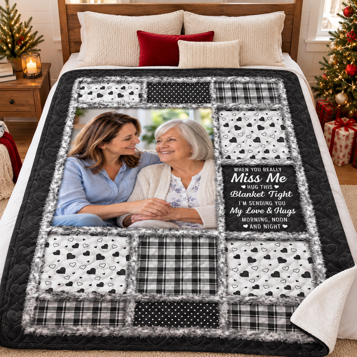 Bed decorated with festive pillows and a hug this blanket tight quilt showcasing a black and white patchwork design.