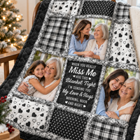 Close-up view of a comfort quilt for mom featuring black and white patchwork, photo panels, and sentimental text.