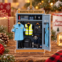 Wilmington Police Department acrylic Christmas ornament displayed upright on rustic wood surface surrounded by holiday