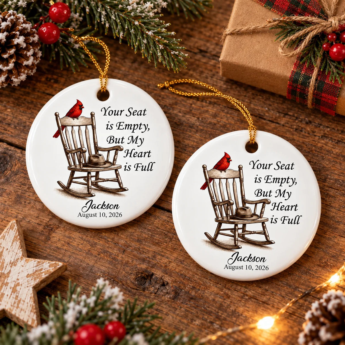 Two round ceramic memorial ornaments with red cardinal and rocking chair design on a rustic wooden table.