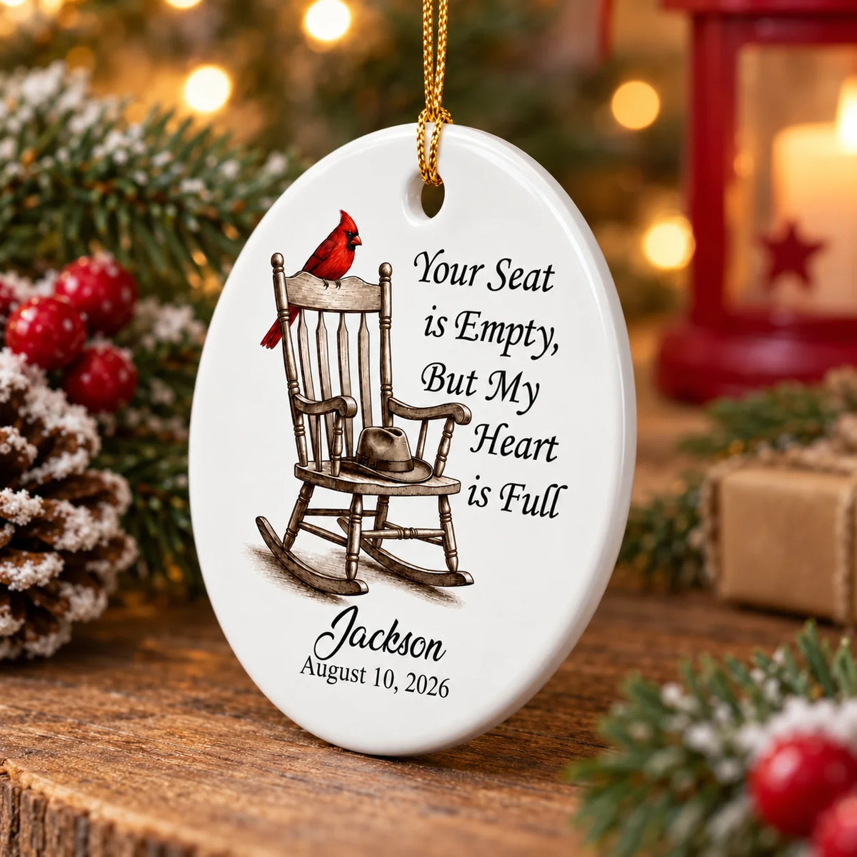 Close-up of a 3-inch white ceramic ornament featuring a red cardinal on a rocking chair with custom text.